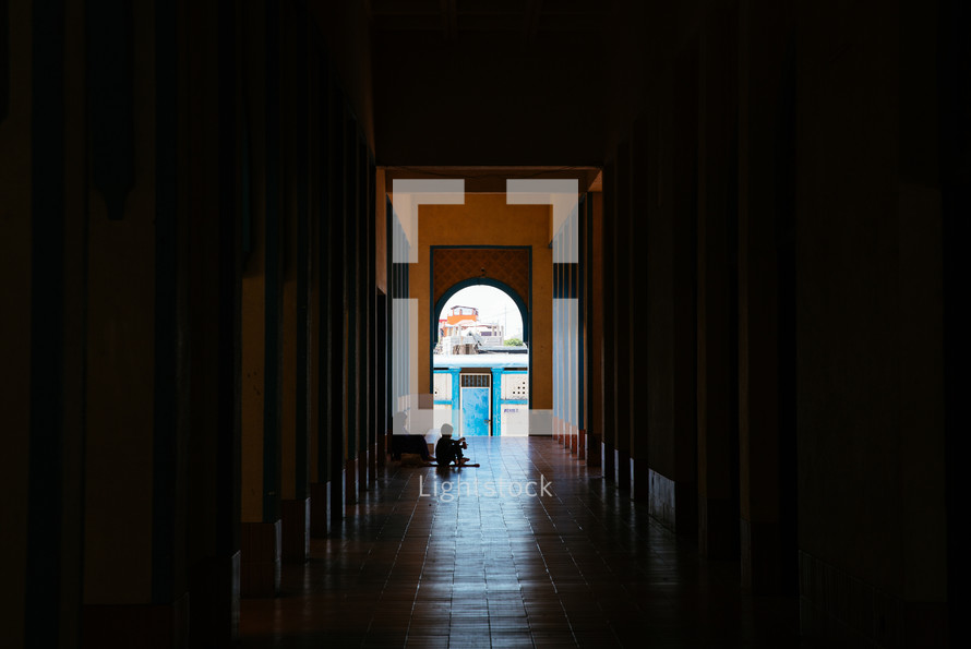 woman and child in a hallway of a church in Taguig Philippines