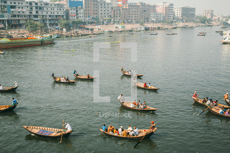 Boats with fishermen in Dhaka river in Bangladesh