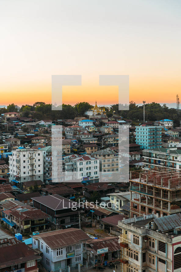 city landscape at sunset with buddhist temple in the background n Taunggyi Myanmar 