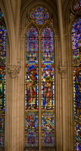 biblical scenes on stained glass giant church window Montpellier