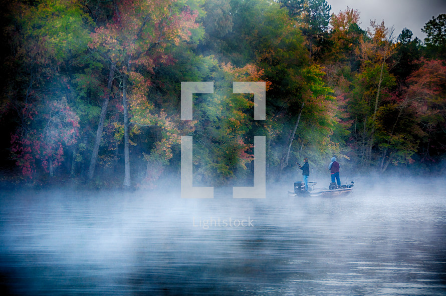 fishing on a lake in fog 
