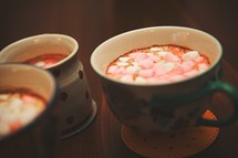 marshmallows in mugs of hot cocoa 