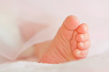 tiny newborn foot