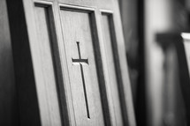 Cross inscribed in wood door
