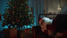Santa Claus sleeping on the sofa