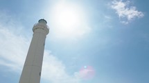 Lighthouse tower under blue sky 