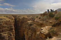 tourists at a canyon lookout