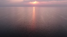 Drone footage over the Sea of Galilee in Israel at sunset.