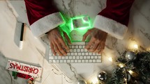 Santa buying online with a futuristic credit card 