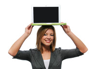 Woman holding a laptop computer on her head.