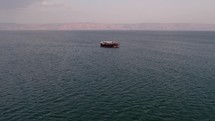Drone footage of a tourist boat in the Sea of Galilee in Israel,
