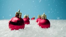 Composition of Christmas balls with snow falling 