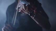 person playing a violin 