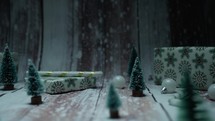 snow on Christmas gifts and decorations
