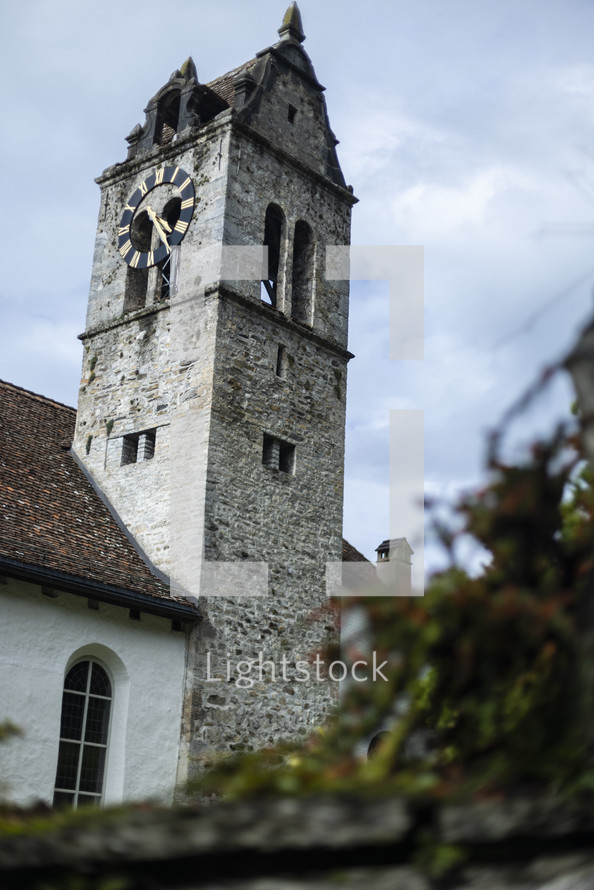 Old stone church with clock tower
