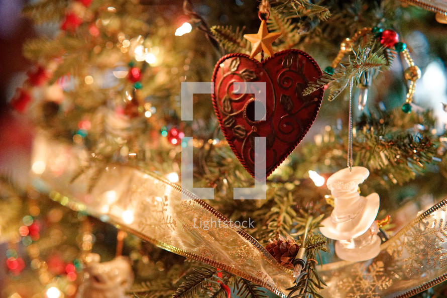 heart shaped Christmas ornament on a Christmas tree 