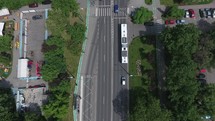 Aerial view with a bus stopping at the station in the city.