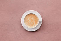 coffee cup on a blush background 