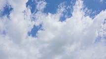 moving clouds in a blue sky