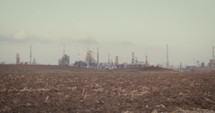 climate change crisis. Kids wearing gas masks near an oil refinery