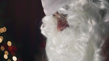 Santa Claus looking at Christmas letters