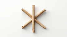 A simple wooden cross against white. It is also a simple symbol for medical care. 