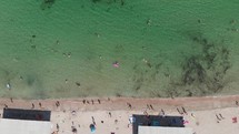 aerial view over a crowded beach 