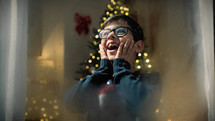 Child amazed by seeing santa On Christmas night