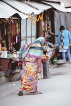 woman in a market in Tibet