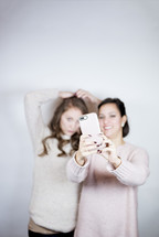 selfies - mother and teen daughter portrait 