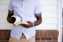 man holding a Bible 