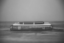pen, journal, and Bible 