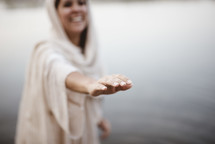 woman in biblical times standing in water 