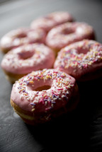 pink sprinkled donuts 