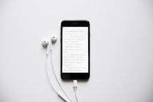 earbuds and Bible app 