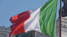 Flag of Italy in Slow Motion, Italian Tricolour National Symbol Green, White and Red - in front of Altar of the Fatherland Altare della Patria in The City of Rome