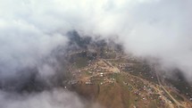 Foggy mountain village aerial