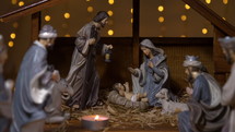 Nativity scene and votive candles 