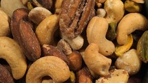 Close up of a rotating assortment of mixed nuts