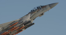 Israeli Air Force F-15 fighter during takeoff armed with bombs and missiles.