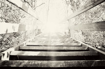 Sun shining on wooden stairway
