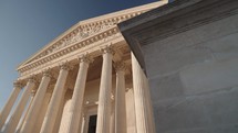 Paris, France - The majestic neoclassical facade of La Madeleine Church in Paris, with its grand Corinthian columns.