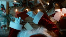 Santa Falling asleep while reading Christmas letters 
