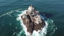 lighthouse on a small rock island 