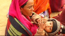 mother holding her infant in India 