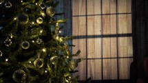 Christmas tree with flashing lights and window shadows