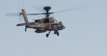 Israeli air force Apache helicopter firing 30mm canon during air strike