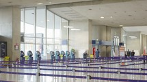 Paris, France - June 25, 2023. Passengers walking inside terminal 2 at Charles de Gaulle airport