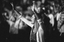 Young woman worshipping at church