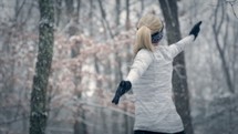 a woman stretching in the snow 